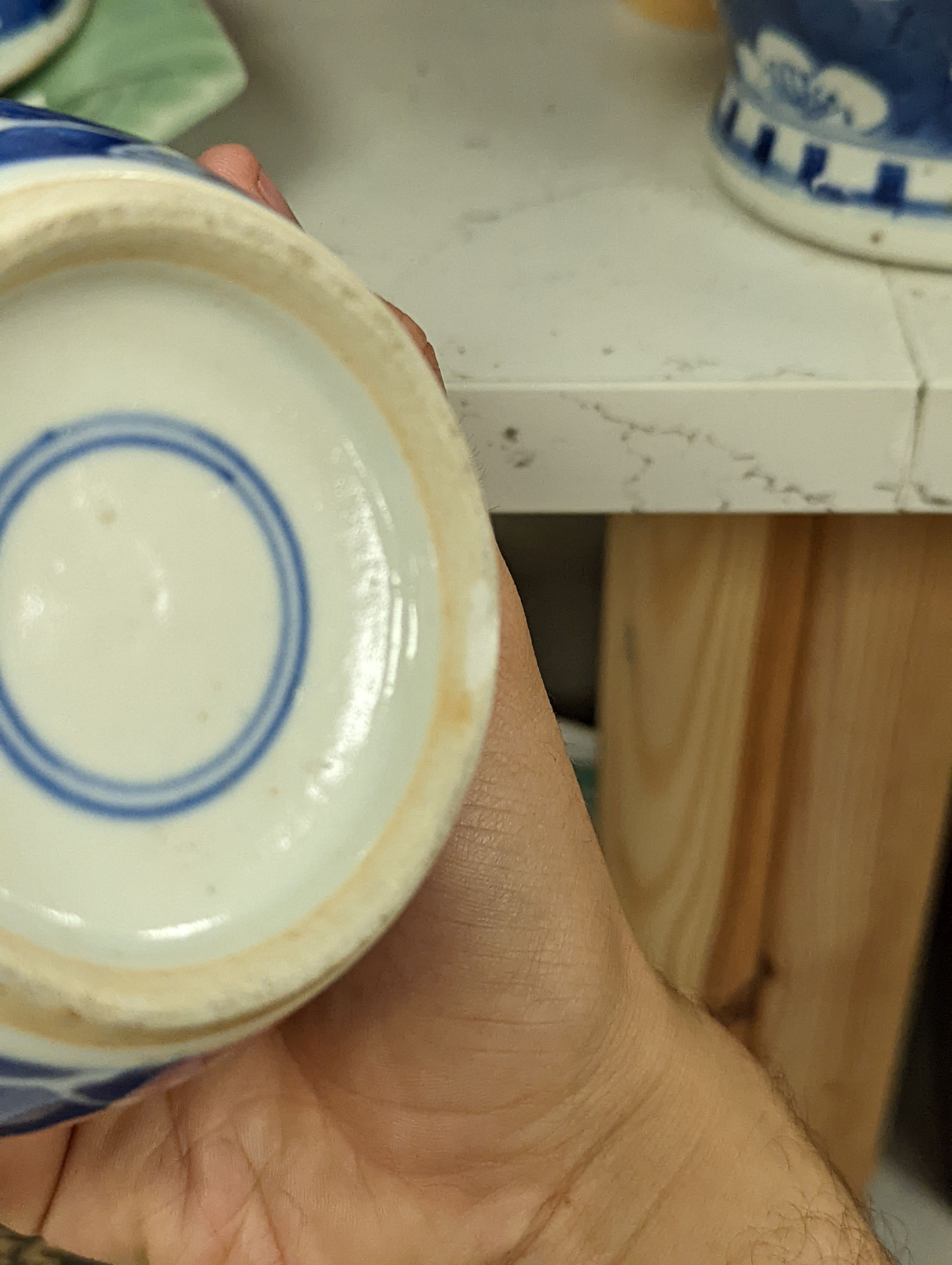 Three Chinese blue and white ginger jars and covers, a celadon plate and bamboo covered vase (5)